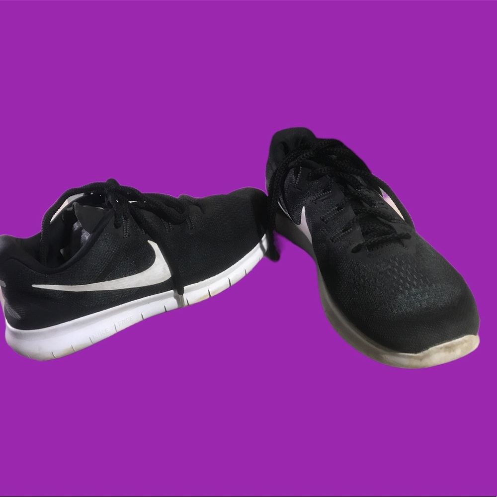 Nike women’s Free RN, black with white trim. Size 10